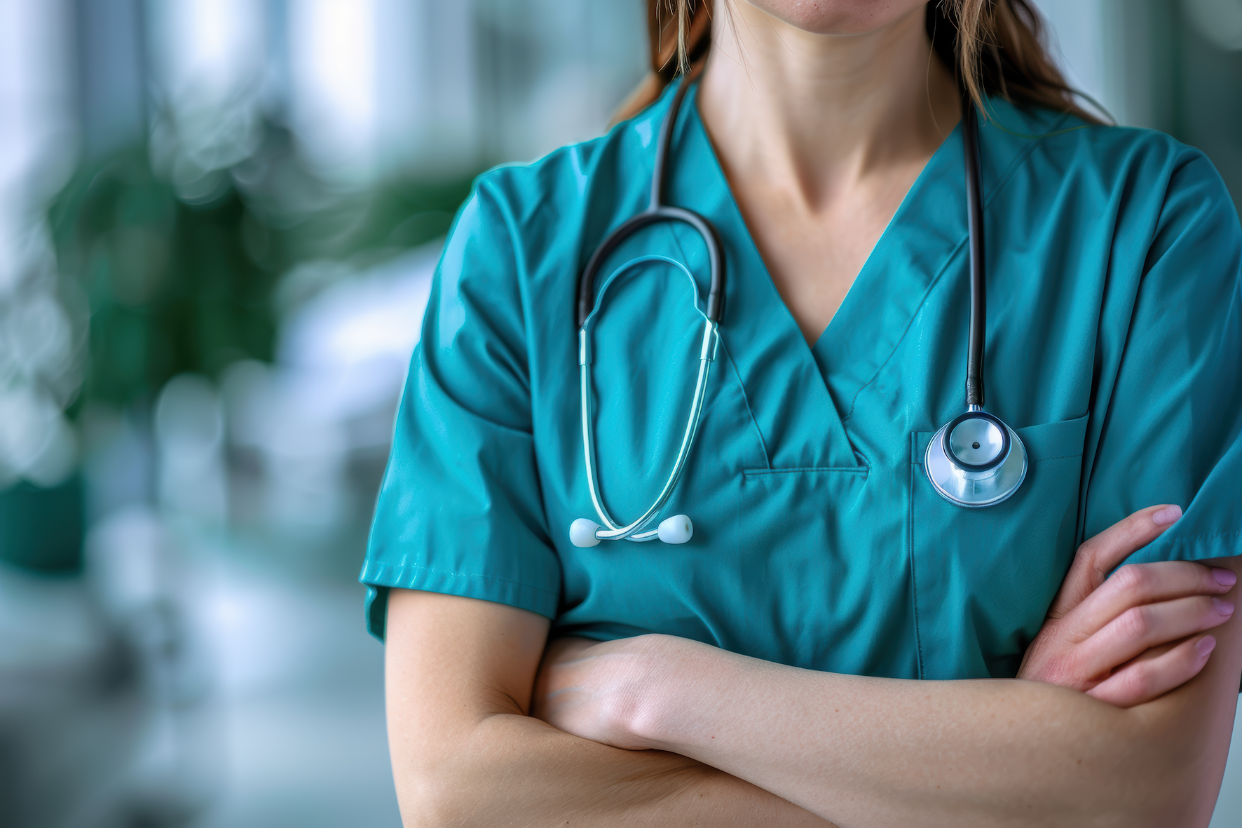 A close up of a person wearing scrubs